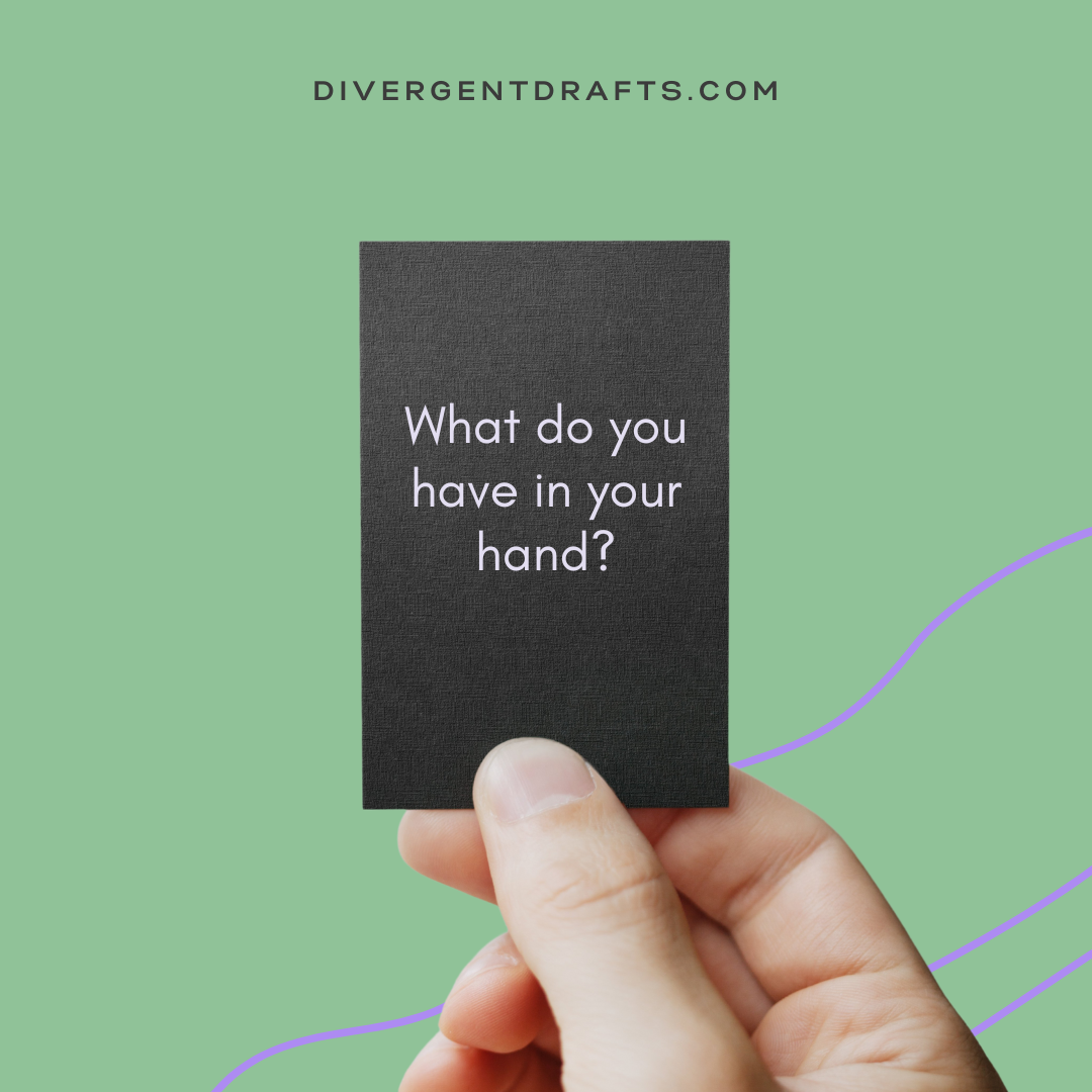 Hand holding a note that asks what do you have in your hand?